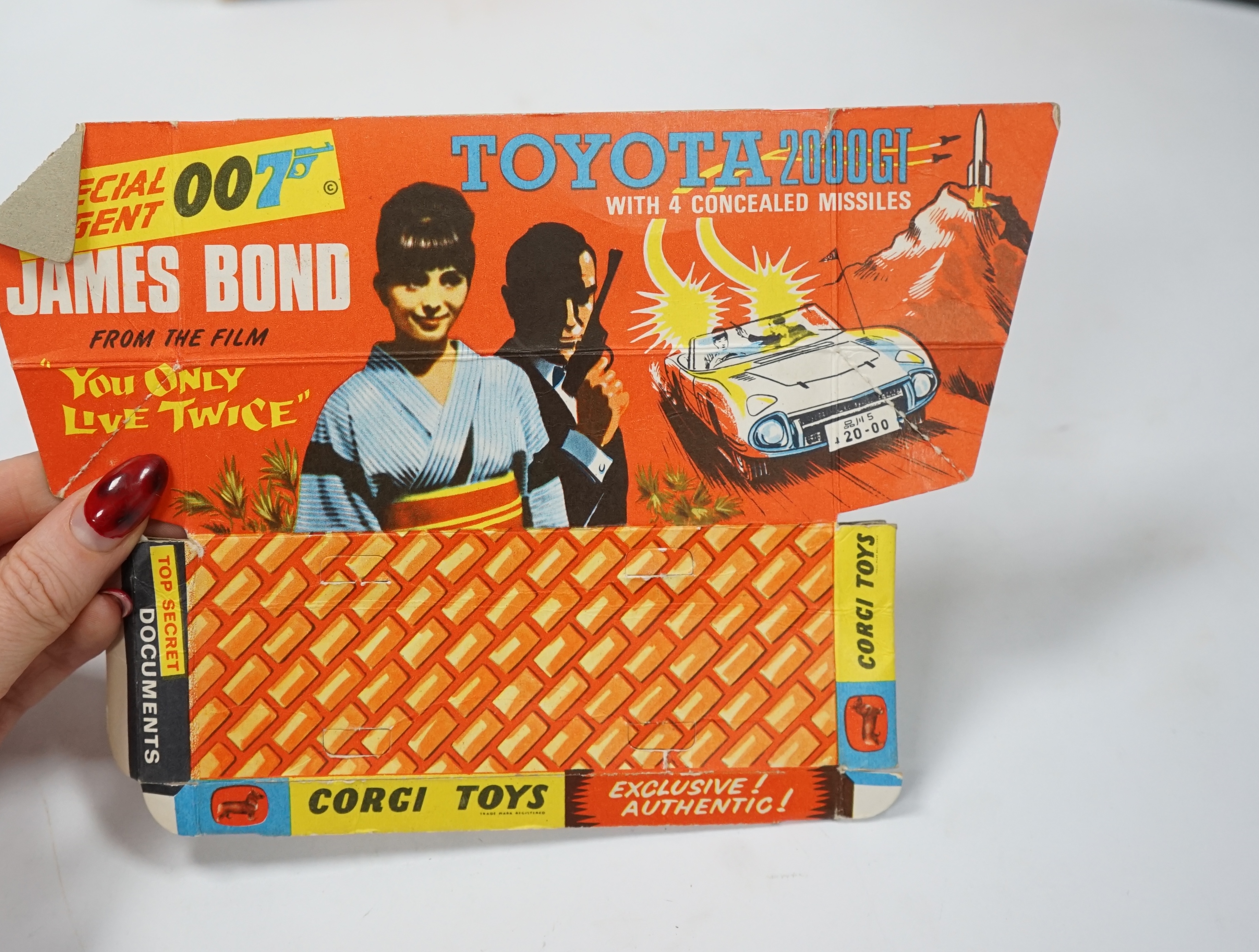 A boxed Corgi Toys (336) James Bond 007 Toyota 2000GT, with the inner display stand, the envelope for the secret instructions, the instruction leaflet and the passenger (other items missing), together with two boxed Tels